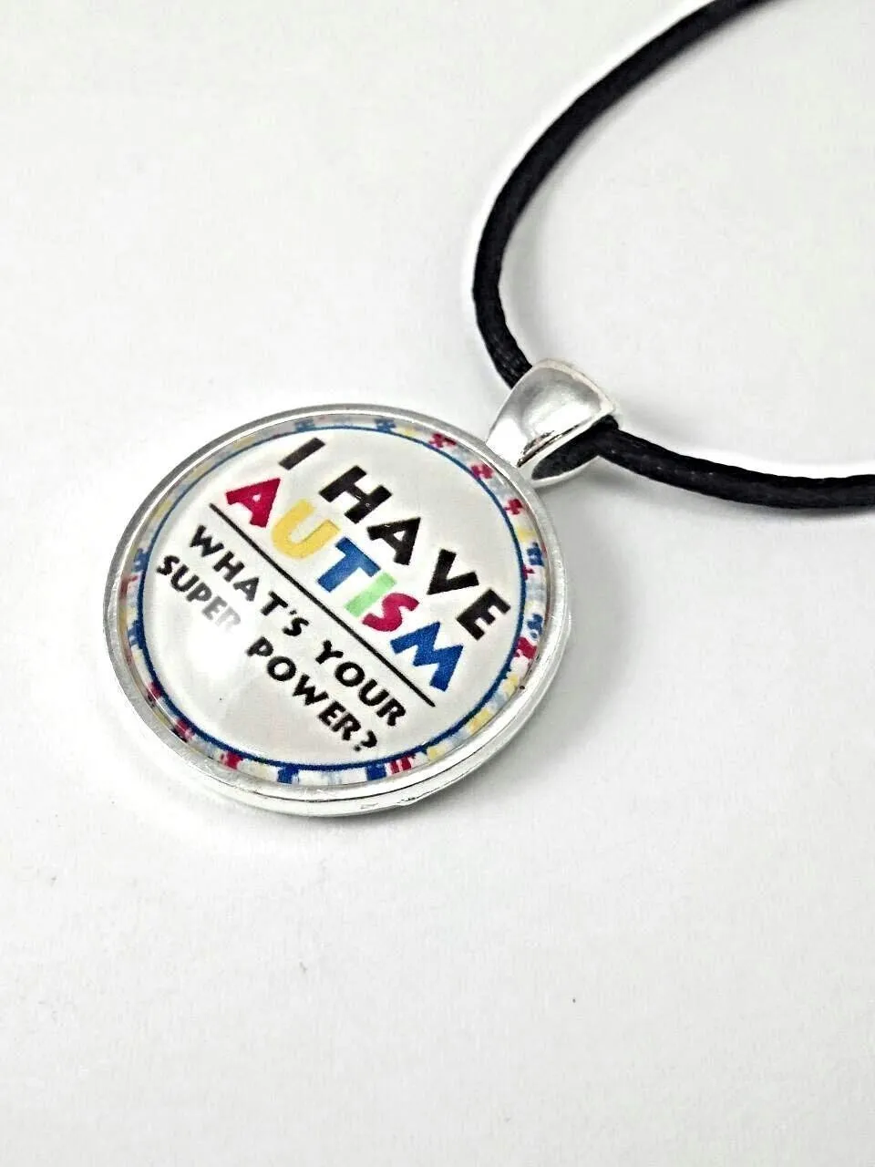 Autism Necklace  "I Have Autism, Whats Your Superpower?" Silver-Plated Pendant with Domed Glass  18-20 Inch Adjustable Black Satin Cord with Lobster Claw Clasp